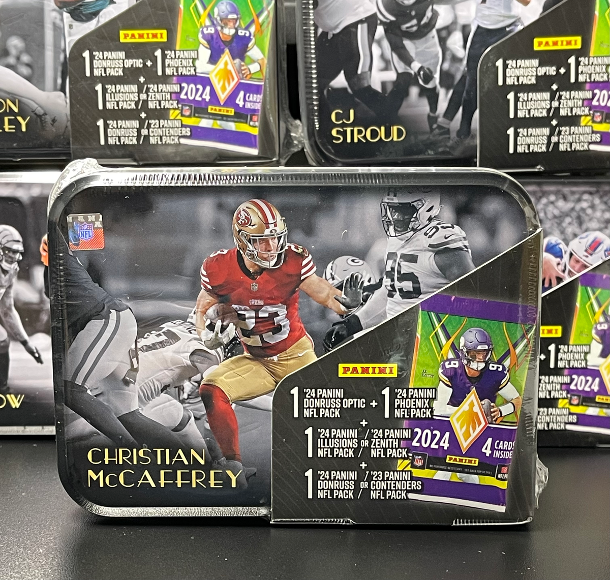 Christian McCaffrey '25 NFL MJ Holding TIN (Includes 2023-24 Panini Packs) image 0