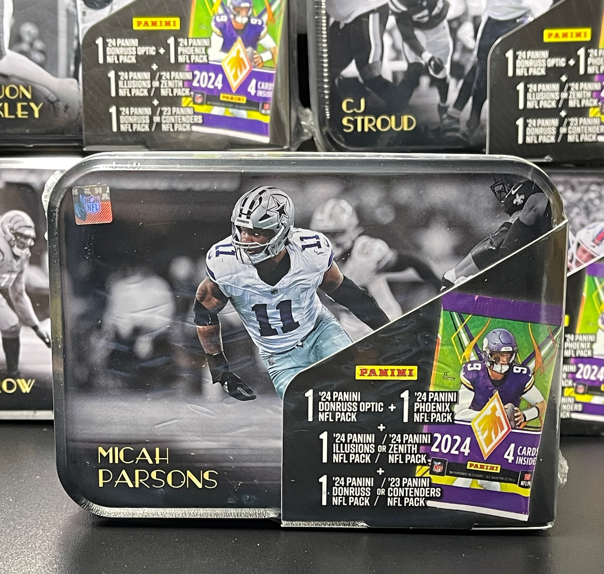 Micah Parsons '25 NFL MJ Holding TIN (Includes 2023-24 Panini Packs) image 0